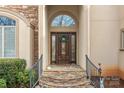 Elegant front door with stone steps, a decorative wreath, and sidelights at 2498 Smith Harbour Dr, Denver, NC 28037
