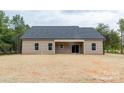 The rear of the house has sliding glass doors which lead to a large covered patio at 3089 Meadowcrest Dr # 28, Clover, SC 29710