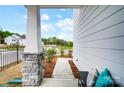 Cozy front porch featuring stone pillar accents and views of the surrounding neighborhood at 604 Cassidy Ct, Clover, SC 29710