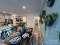 Kitchen with island and adjacent dining area with seating for six at 616 Cassidy Ct, Clover, SC 29710