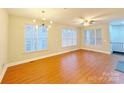 Spacious living room with hardwood floors and large windows at 6726 Mallard Park Dr, Charlotte, NC 28262