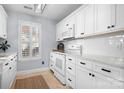 Beautiful kitchen featuring white cabinets, marble countertops, tile backsplash, and stainless steel appliances at 8338 Brickle Ln, Huntersville, NC 28078