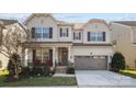Charming two-story home featuring a covered front porch and a two-car garage at 840 Pecan Tree Ln, Fort Mill, SC 29715