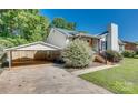 Single carport with a spacious driveway and well-maintained yard at 1304 Armstrong Ford Rd, Belmont, NC 28012