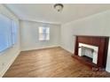 Bright living room with hardwood floors and a fireplace at 1618 4Th St, Salisbury, NC 28144