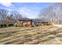 Ranch home exterior with a spacious lawn at 220 Augusta Dr, Statesville, NC 28625