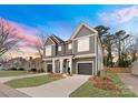 New construction duplex boasting neutral color palette, attached garages, and modern curb appeal at 2221 Edison St, Charlotte, NC 28206