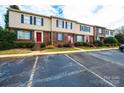 Brick and siding townhouses with red doors and parking at 2705 N Center St # 65, Hickory, NC 28601
