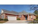 Brick ranch home with attached garage and manicured landscaping at 4026 Saint James Way # 1, Monroe, NC 28110
