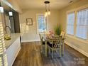 Light-filled dining area adjacent to the kitchen, perfect for Gathering meals at 407 Talleyrand E St, Monroe, NC 28112