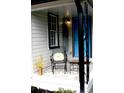 Cozy front porch area with a chair, table, and decorations at 407 Talleyrand E St, Monroe, NC 28112