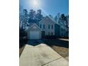 Two-story house with attached garage and driveway at 4225 Parkdale Dr, Charlotte, NC 28208