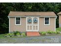 Charming shed with decorative wreaths, offering extra storage on the property at 4816 Zion Church Rd, Concord, NC 28025
