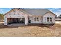 New home construction showcasing framed entrance, garage, and windows at 5177 Flay Rd, Lincolnton, NC 28021