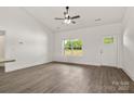 Inviting living room features hardwood floors, natural light streaming through the windows, and a welcoming entry door at 5177 Flay Rd, Lincolnton, NC 28021
