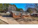 Brick ranch home with a view of the front yard and trees at 5584 Valley Field Rd, Hickory, NC 28602