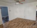 Living room featuring wood-look floors and a ceiling fan at 605 E Horah St, Salisbury, NC 28144