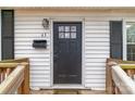 Close-up of the front door, showcasing the house number, mailbox, and exterior lighting at 65 Franklin St, Wadesboro, NC 28170