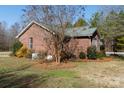 Side view of brick ranch house with mature trees at 665 Edwards Rd, Fort Lawn, SC 29714