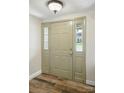 Elegant front door with sidelights offering a glimpse of the outside at 9108 Nolley Ct # B, Charlotte, NC 28270