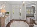Bright and spacious entryway with hardwood floors and a view to the kitchen at 9635 Andres Duany Dr, Huntersville, NC 28078