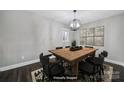 Bright dining room featuring a modern chandelier and ample seating at 1019 Palmyra Dr, Fort Mill, SC 29708