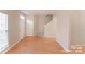 Inviting living room with hardwood floors and staircase at 10946 Garden Oaks Ln, Charlotte, NC 28273