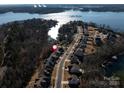 Aerial view of house and neighborhood by Lake Wylie at 16400 Cozy Cove Rd, Charlotte, NC 28278