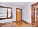 Entryway featuring refinished hardwood floors, original trim, and plenty of natural light at 1648 Newton Dr, Statesville, NC 28677