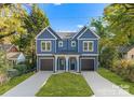 Two-unit building with attached garages and a shared front yard at 2149 Highland St, Charlotte, NC 28208