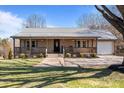 Inviting single-story home with a covered front porch and well-maintained landscaping at 236 Ervin Rd, Mooresville, NC 28117