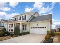 Well-maintained home with a two-car garage, stylish siding, and beautiful landscaping at 328 Sensibility Cir, Fort Mill, SC 29708