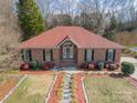 Inviting brick home with a well-maintained front yard and a stepping stone walkway at 3447 Nesting Ln, Fort Mill, SC 29708