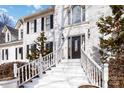 Elegant front entrance with white staircase and black door at 4001 Carmel Acres Dr, Charlotte, NC 28226