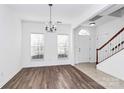 Bright dining room with hardwood floors and chandelier at 6019 Queens Walk Ct, Fort Mill, SC 29707