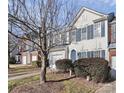 Townhome exterior showcasing a tree and manicured shrubs at 6019 Queens Walk Ct, Fort Mill, SC 29707