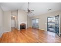 Spacious living room features a fireplace, hardwood floors, and natural light at 781 Woodlawn Ave, Mount Holly, NC 28120