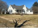 Exterior showcasing the side of a house with a separate garage and a spacious, open lawn area at 897 Mocksville Hwy, Statesville, NC 28625