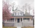 Beautiful two-story home with a welcoming covered porch, showcasing classic architectural details and curb appeal at 105 N Inman Ave, Bessemer City, NC 28016