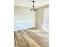 Bright dining room with light gray walls and wood-look flooring at 10933 Harrowfield Rd, Charlotte, NC 28226