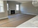 Bright living room with fireplace and large windows at 13708 Tranquil Day Dr, Matthews, NC 28105
