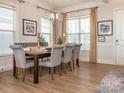 Bright dining room with a large table and comfortable seating at 14543 Crosswater Ln, Charlotte, NC 28278