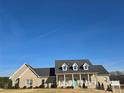 Charming brick home with welcoming front porch and well-manicured lawn at 2510 Lentz Rd, China Grove, NC 28023
