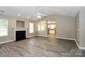 Spacious living room with fireplace, vaulted ceiling, and laminate floors at 2773 Ramble Wood Ct, Rock Hill, SC 29730