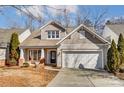 Inviting home featuring a neutral exterior, manicured landscaping, and a convenient two-car garage at 3323 Darlington Rd, Matthews, NC 28105