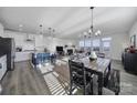 Bright open concept floorplan connecting the kitchen, dining area, and living room at 343 Embers Ln, Clover, SC 29710