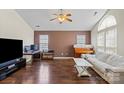 Spacious living room with hardwood floors, vaulted ceiling, and a comfortable seating area at 3507 Southern Ginger Dr, Indian Trail, NC 28079