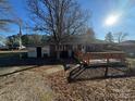 Back of house with deck and partial view of yard at 518 Glenn St, Chester, SC 29706