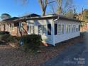 Side view of the house showing the brick and sunroom at 518 Glenn St, Chester, SC 29706