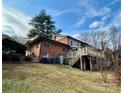 Brick home with deck and hillside setting at 110 30Th Nw Ave, Hickory, NC 28601